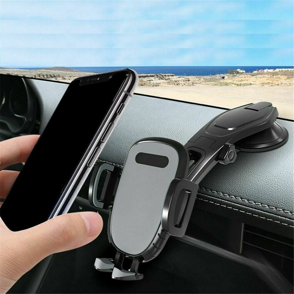 Phone holder on car dashboard with ocean view