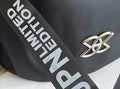 Black bag with a strap displaying 'Super Limited Edition' and a gold logo.