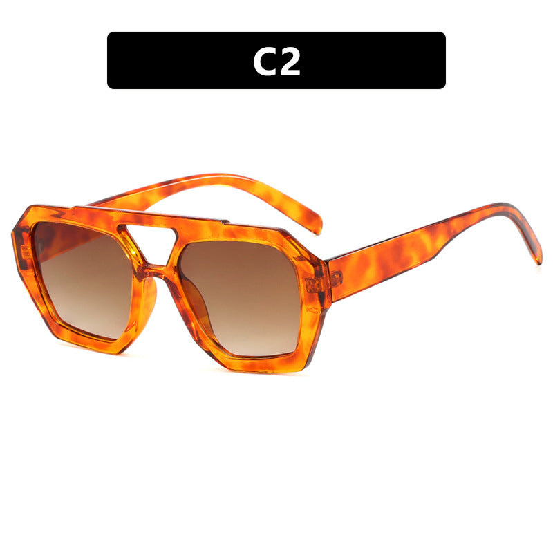 Orange tortoiseshell sunglasses with a gradient lens 
