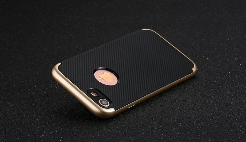 Phone case with gold edge and black back on a dark background