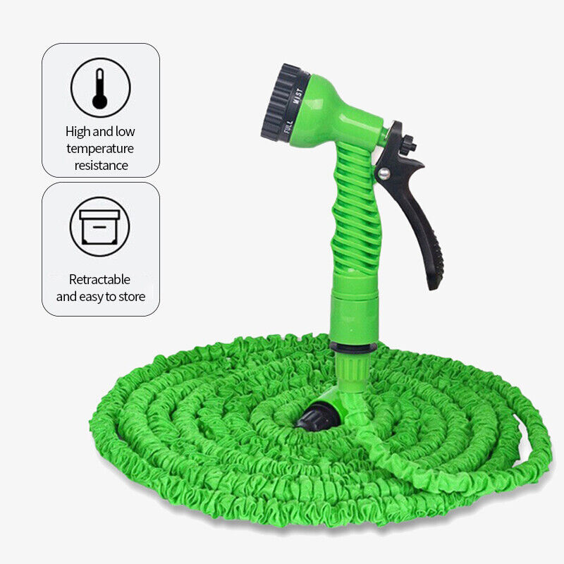 Green expandable garden hose with spray nozzle on a white background