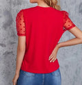 Lightweight polyester women’s summer top on hanger

