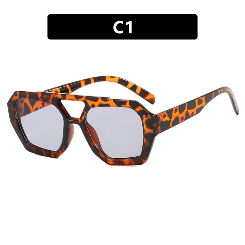 Sunglasses with tortoiseshell frame and clear lenses