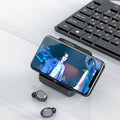 Smartphone with a video call on screen, wireless earbuds, and keyboard