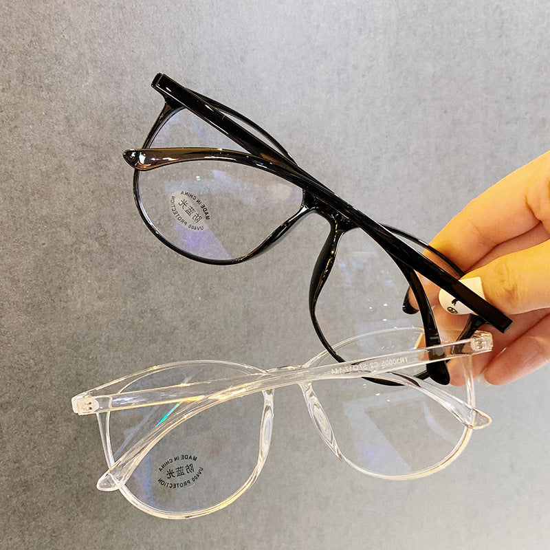 Black and clear eyeglasses held