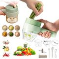Handheld food chopper with ingredients and accessories on a white background