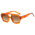 Orange tortoiseshell sunglasses with brown lenses