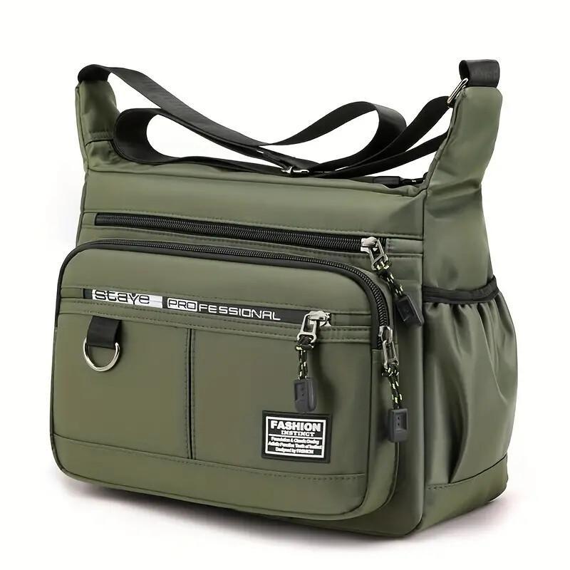 Green shoulder bag with multiple zippers