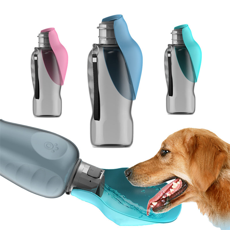 Dog drinking water from a blue pet water bottle with additional bottles in different colors