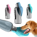 Dog drinking water from a blue pet water bottle with additional bottles in different colors