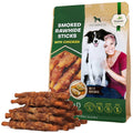 Bag of smoked rawhide sticks with chicken for dogs, featuring a dog and person on the packaging.