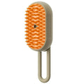 Pet grooming brush with orange bristles on a beige handle against 
